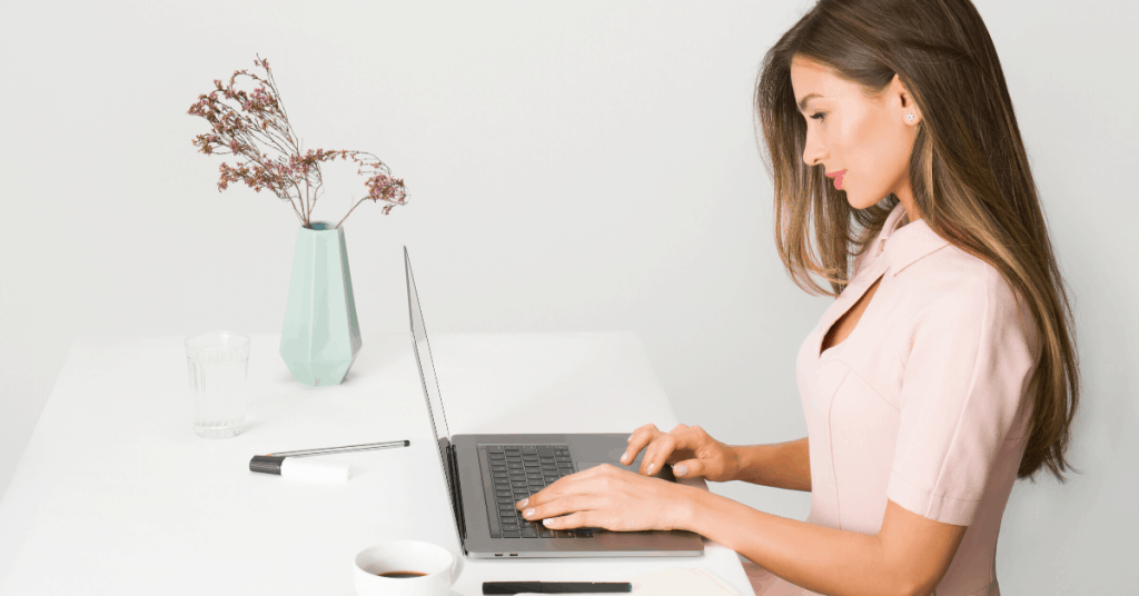 Woman on a laptop; a featured image on LOJO Marketing's "Website Redesign Guide - Updating Your Business Website Made Easy"