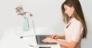 Woman on a laptop; a featured image on LOJO Marketing's "Website Redesign Guide - Updating Your Business Website Made Easy"