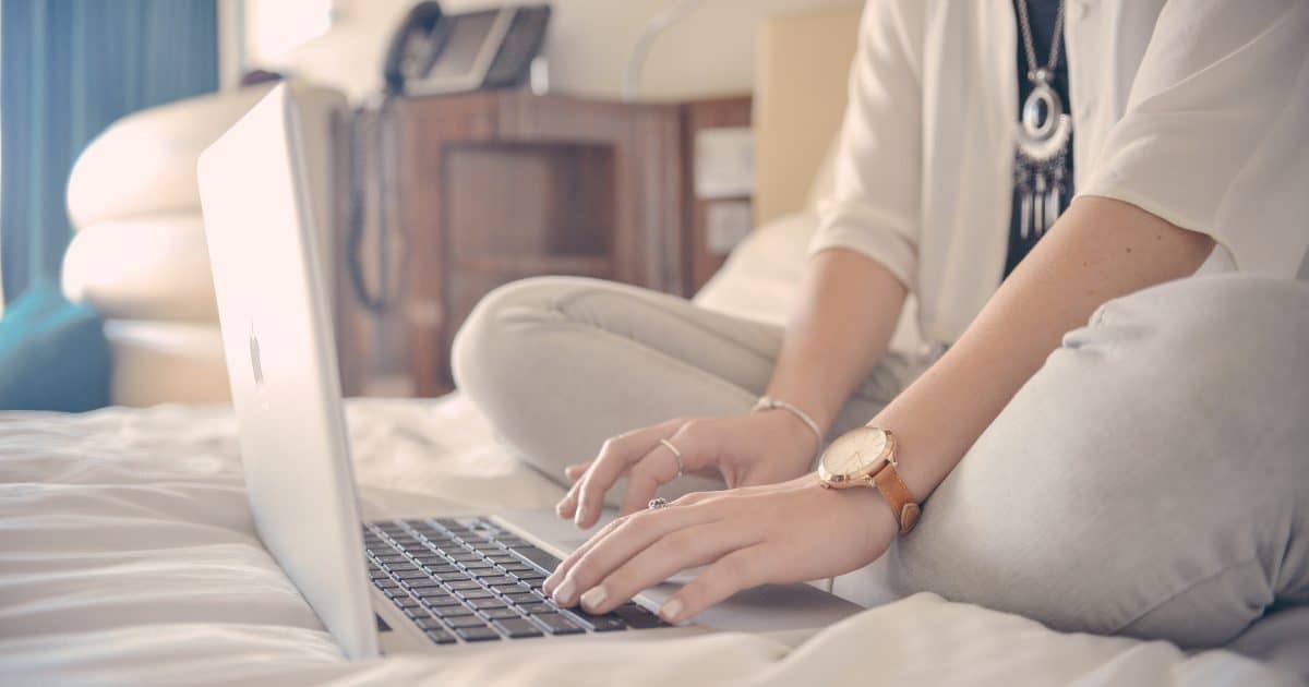 An entrepreneur blogging on a laptop | a featured image from the LOJO article, "How Often Should I Be Blogging?"