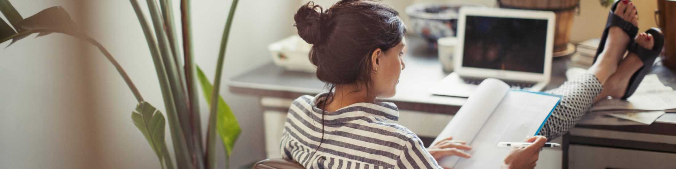 An entrepreneur relaxedly working from home | a featured image from the LOJO resource, "Work-From-Home Resources (for Work-From-Home Folk)."