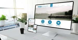 A small business website rendered on desktop and a couple other smaller mobile devices | a featured image from "8 Common Web Design Mistakes Many Business Owners Make (And How To Avoid Them)", an article from LOJO Marketing.